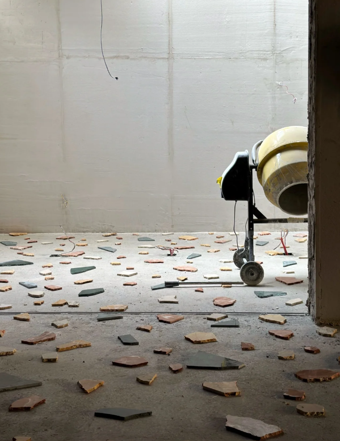What is the construction process of cast-in-place terrazzo?