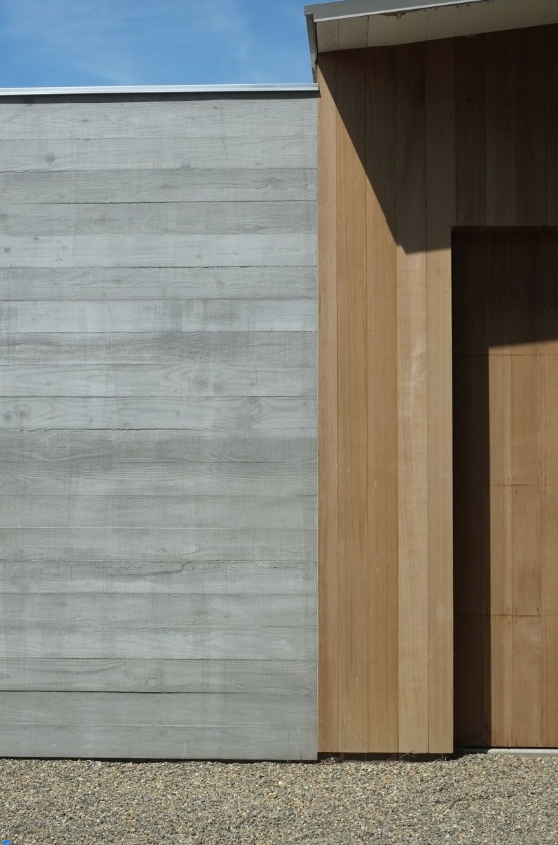 How does wood grain cement board simulate the wood grain effect?