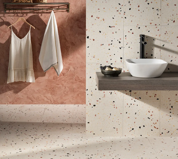 What makes terrazzo tiles a suitable choice for the hospitality industry?