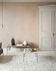 Matte beige terrazzo tiles provide a natural stone texture to interiors