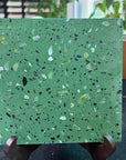 The eye-catching green terrazzo slab brings a natural and fresh feeling to the space